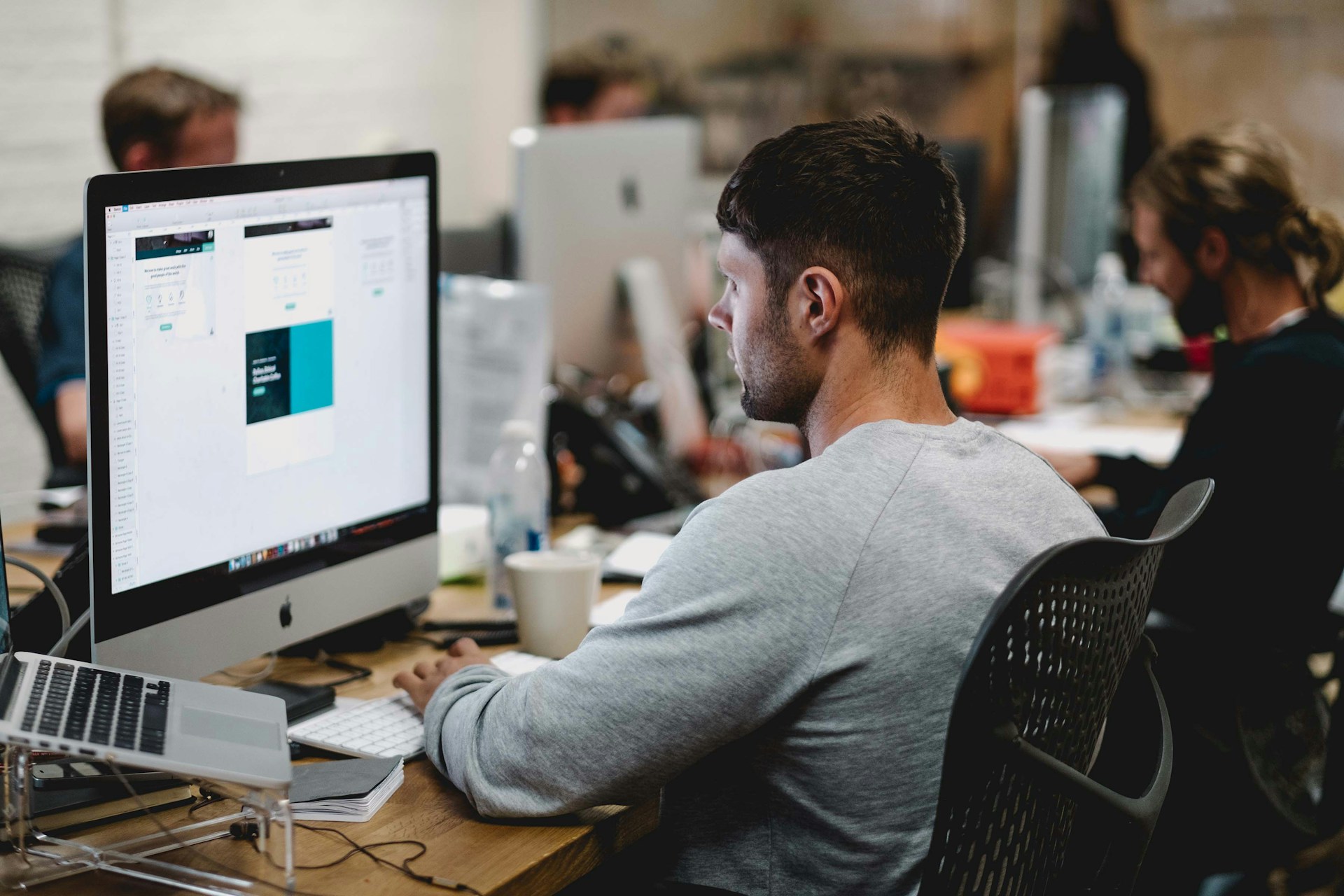 Business owner consulting with a website design company on a new project