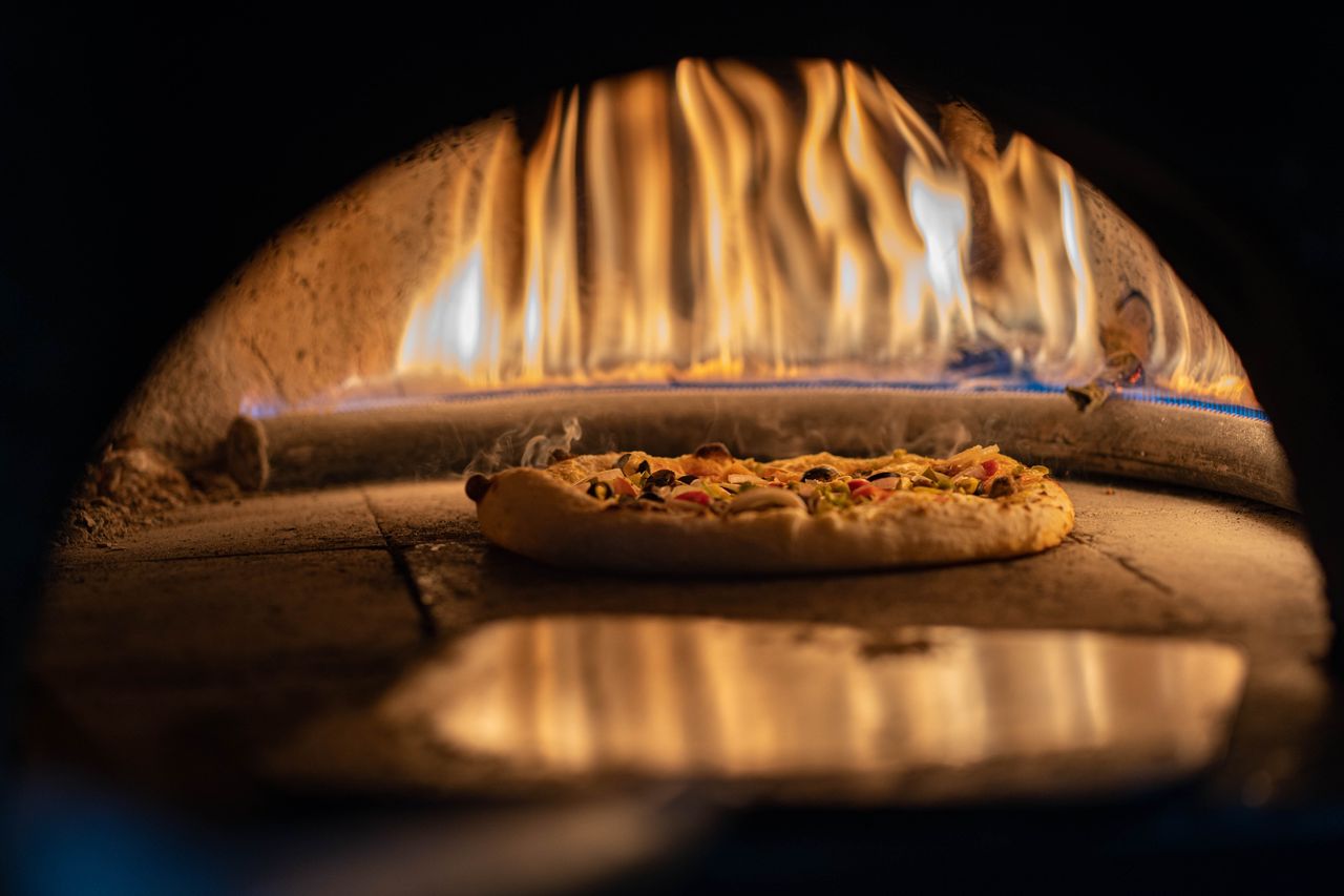 Wood-fired and gas pizza ovens ready for outdoor cooking