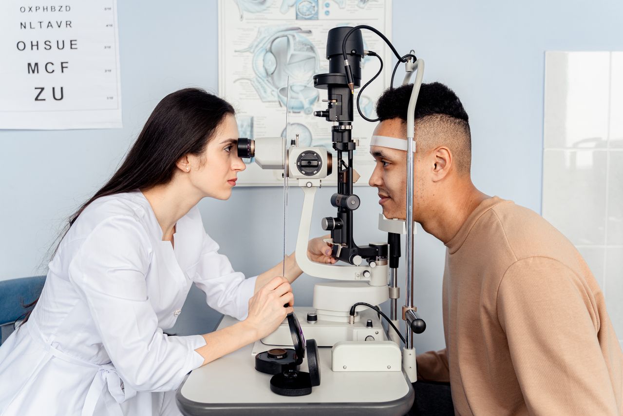 Adult having a routine eye test with an optometrist